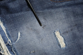Jeans para hombre de algodón lavado azul con desgastes