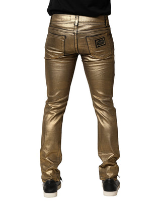 Jeans ajustados de mezclilla de algodón elástico dorado con desgastes