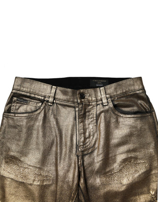 Jeans ajustados de mezclilla de algodón elástico dorado con desgastes