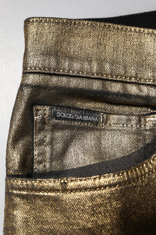 Jeans ajustados de mezclilla de algodón elástico dorado con desgastes