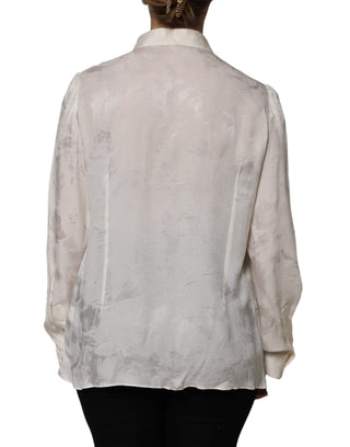 Blusa blanca con botones y mangas largas