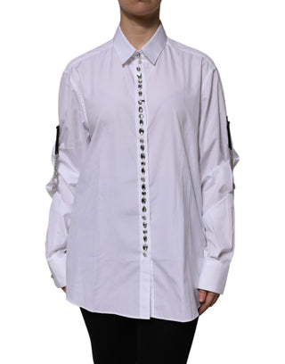 Top blanco con mangas largas y adornos de pedrería