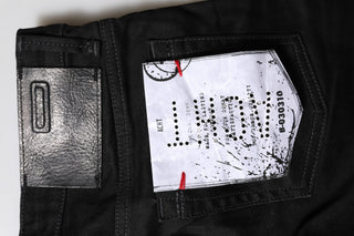 Jeans de mezclilla ajustados de algodón negro con cintura baja