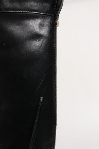 Schwarze hohe Stiefel aus Leder mit Schnallen