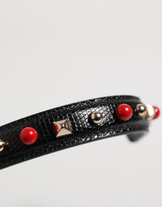 Bolso de cuero negro adornado con asa y correa de hombro para mujer