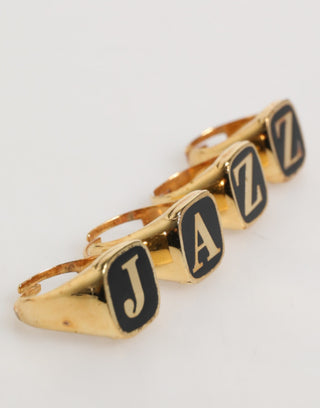 Anillo ajustable de latón tono dorado con letras JAZZ, set de 4 piezas