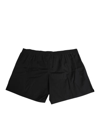 Schwarze Badehose mit elastischem Bund und Knöpfen aus Baumwolle
