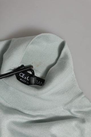 Top gris con cuello alto tipo tortuga y mangas 3/4