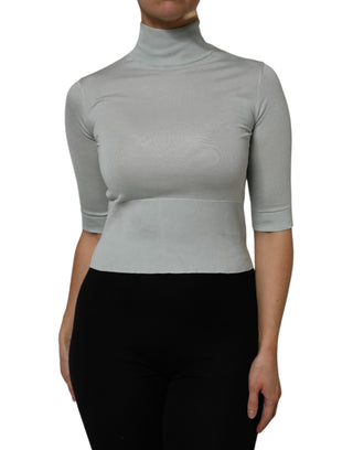 Top gris con cuello alto tipo tortuga y mangas 3/4