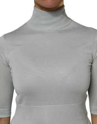 Top gris con cuello alto tipo tortuga y mangas 3/4