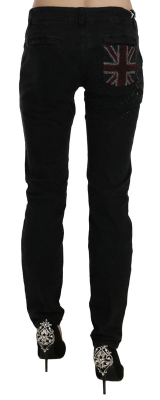 Jeans pitillo de mezclilla negra de cintura baja con pintura blanca