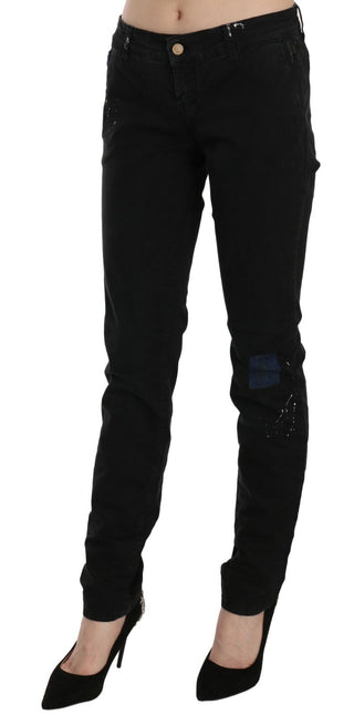 Jeans pitillo de mezclilla negra de cintura baja con pintura blanca