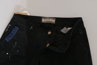 Jeans pitillo de mezclilla negra de cintura baja con pintura blanca