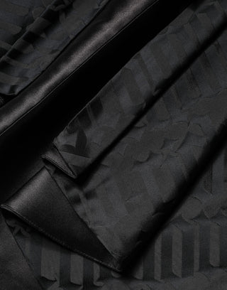 Vestido negro de dos piezas sin mangas con escote en V profundo y jacquard