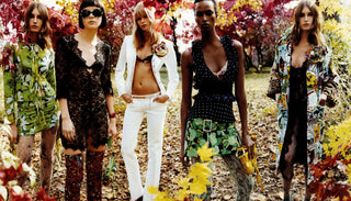 Five models in a forest setting wearing patterned clothing.