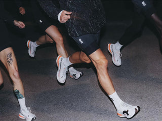 Close-up of people running with focus on shoes and socks